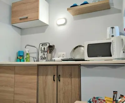 a kitchen with a microwave and a counter top at The Mill House Stella in Symi