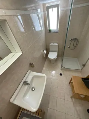 a bathroom with a sink and a shower and a toilet at MV central in Rhodes Town