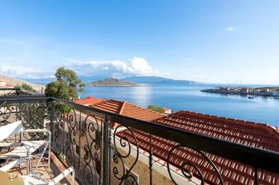 a balcony with a view of a body of water at Villa Lola in Halki