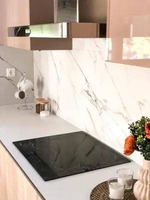 a kitchen with a black sink on a counter at Luxury Villa Anemone with private pool in Pastida