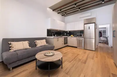 a living room with a couch and a table at Kimia Luxury Apartments in Kolimbia