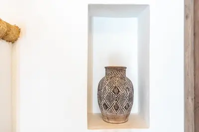 a vase sitting on a shelf in a room at Alicia's Traditional Home In Paradisi in Paradeísion