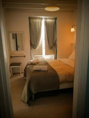 a bedroom with two beds and a window at Marietta's House in Rhodes Town