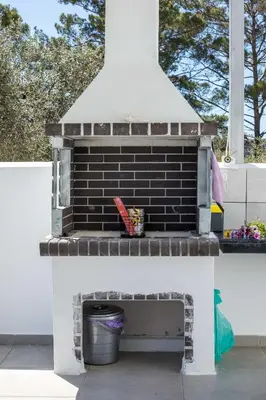 a pretend brick oven with a trash can inside at VillaPhysis with Private Pool in Lardos