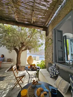 a living room with a couch and a table at The Anchor House in Symi