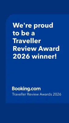 a blue sign that says were proud to be a traveller reviewagency winner at Villa Bianca in Kremasti