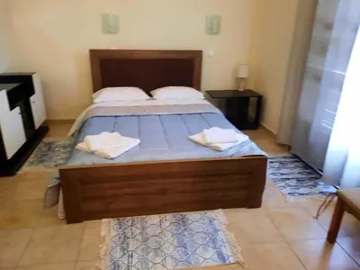 a bedroom with a bed with two towels on it at Villa Bianca in Kremasti