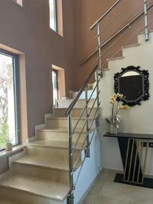 a staircase in a home with a metal railing at Villa Chrysa Rhodes with Heated Pool in Afantou