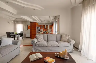 a living room with a couch and a table at Casa di Vasia in Gennadi