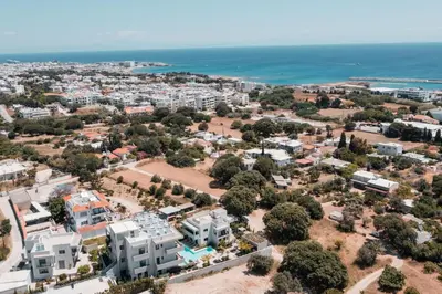 an aerial view of the city and the ocean at Sun City Luxury Apartments in Rhodes Town