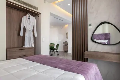 a bedroom with a large bed and a mirror at ANIMA DEL SOL ( LEVANTA ) in Ixia