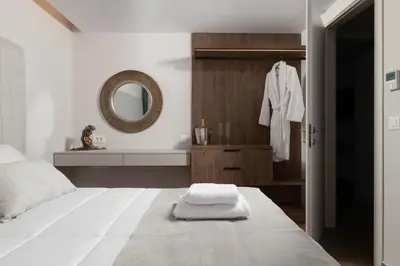 a bedroom with a white bed and a mirror at ANIMA DEL SOL ( LEVANTA ) in Ixia