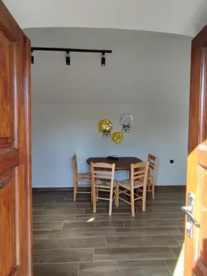 a dining room with a table and chairs at Althea Apartments 3 in Halki