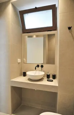 a bathroom with a sink and a mirror at Borgo Nuovo in Rhodes Town