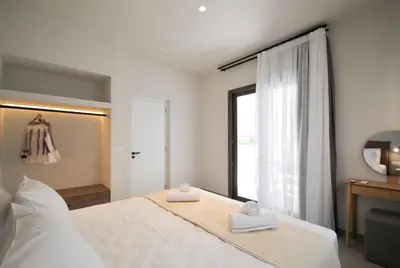 a bedroom with a bed with two towels on it at Borgo Nuovo in Rhodes Town