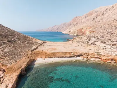 a large pool of water in a desert with the ocean at EliteDIMension Chalki in Halki