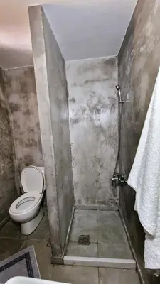 a bathroom with a toilet and a shower at Villa Kavalino in Kolimbia