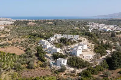 an aerial view of a villa with white buildings at Massari Hills Luxury Living in Malona Village