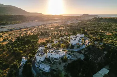 an aerial view of a white villa with the ocean at Massari Hills Luxury Living in Malona Village