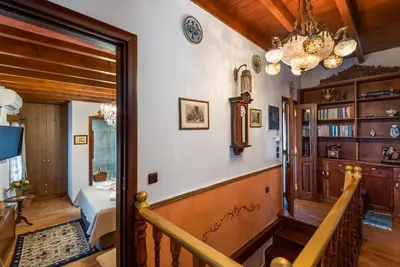 a staircase in a home with a chandelier at Mythic Spa Villa in Rhodes Town