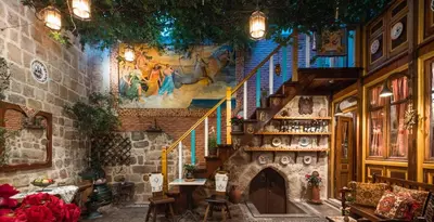 a staircase in a building with a stair case at Mythic Spa Villa in Rhodes Town
