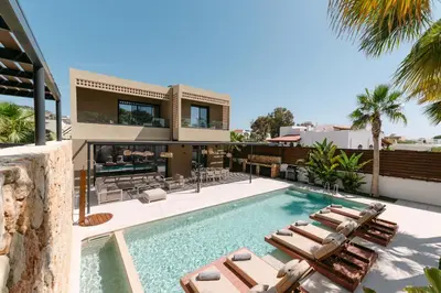 an image of a house with a swimming pool and lounge chairs at STALèA Luxury Villa in Pefki Rhodes