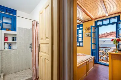 a bathroom with a shower and a shower backdoor at Chalki Jewel in Halki