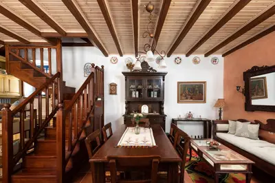a living room with a table and a couch at Chalki Jewel in Halki