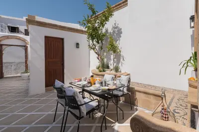 a table and chairs sitting on a patio at Althea Villa in Líndos