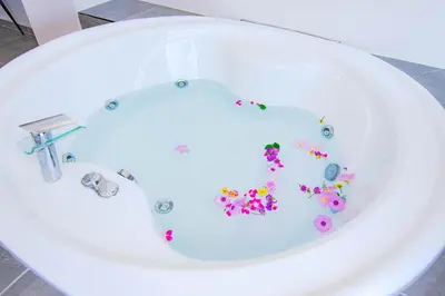 a bath tub filled with flowers in the shape of a toilet at FRESH HOTEL FALIRAKI in Faliraki