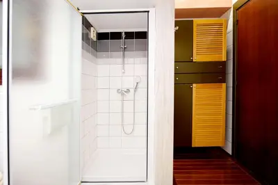 a bathroom with a shower with a glass door at Martha's Home in Rhodes Town
