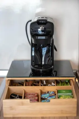 a black coffee maker sitting on top of a table at Dolce Casa Suite1 in Afantou