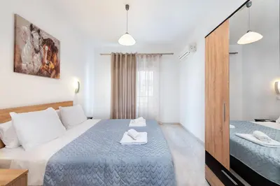 a bedroom with two beds in a room at Dolce Casa Suite1 in Afantou