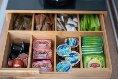 a wooden drawer filled with different types of food at Dolce Casa Suite1 in Afantou