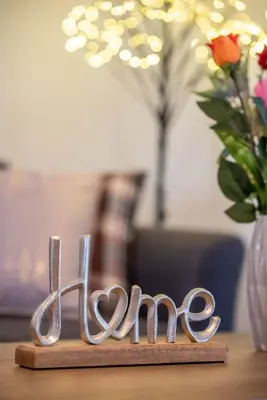 a wooden sign that says love on a table at Dolce Casa Suite1 in Afantou