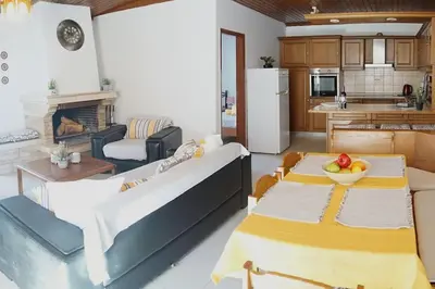 a living room with a couch and a table at Irene's Apartment In Salakos in Sálakos