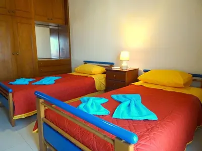 two beds sitting next to each other in a room at Irene's Apartment In Salakos in Sálakos