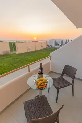 a table with a bowl of bananas on a balcony at Viva Tourismo Resort (naturist club) in Paradeísion