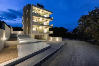 a building with lights on the side of a road at Panorama Luxury Penthouse in Ixia