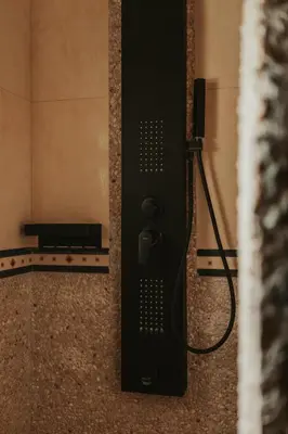a black object is attached to a wall at Maya pool & mountain view villa in Koskinou