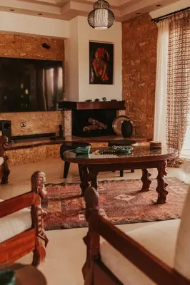 a living room with a coffee table and a piano at Maya pool & mountain view villa in Koskinou