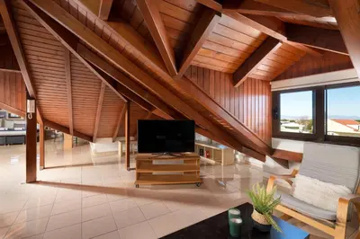 a large living room with a flat screen tv at Emmelia Villa in Ialyssos
