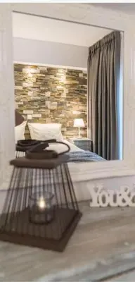 a bedroom with a bed and a mirror at Rhodes Center Luxurious Penthouse in Rhodes Town