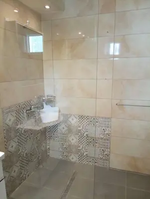 a bathroom with a sink and a shower at Katias downtown apartment in Rhodes Town