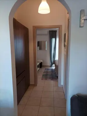a hallway leading to a room with a hallwayngthngthngthngthngthngthngth at Comfy Cozy Iksia in Ixia