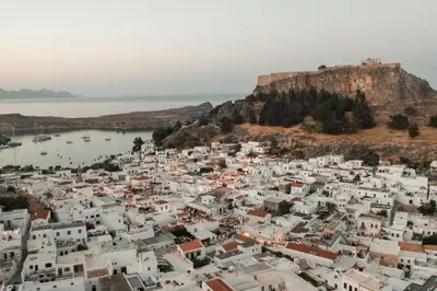 an aerial view of a town on a hill at Noema Lindos - Angeliki Suite in Líndos