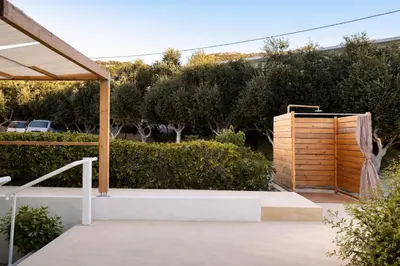 a patio with a wooden fence and a wooden box at ANGELOS STUDIOS 3-4 in Faliraki Rhodes-Upper Floor in Faliraki