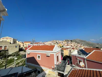 a view of a city from the roofs of buildings at Casa Chara 2 in Symi