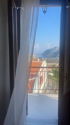 an open window with a view of a balcony at Casa Chara 2 in Symi