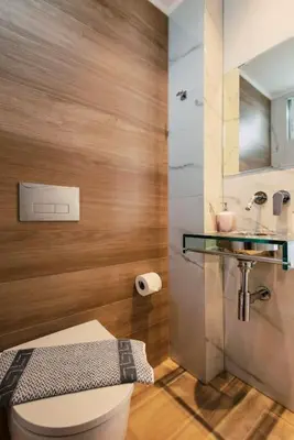 a bathroom with a toilet and a sink at Myrovolos luxury Eneida's house in Ialyssos